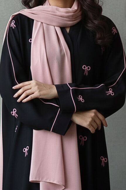 Black abaya with pink bow embroidery in crepe fabric by Nimah Wear